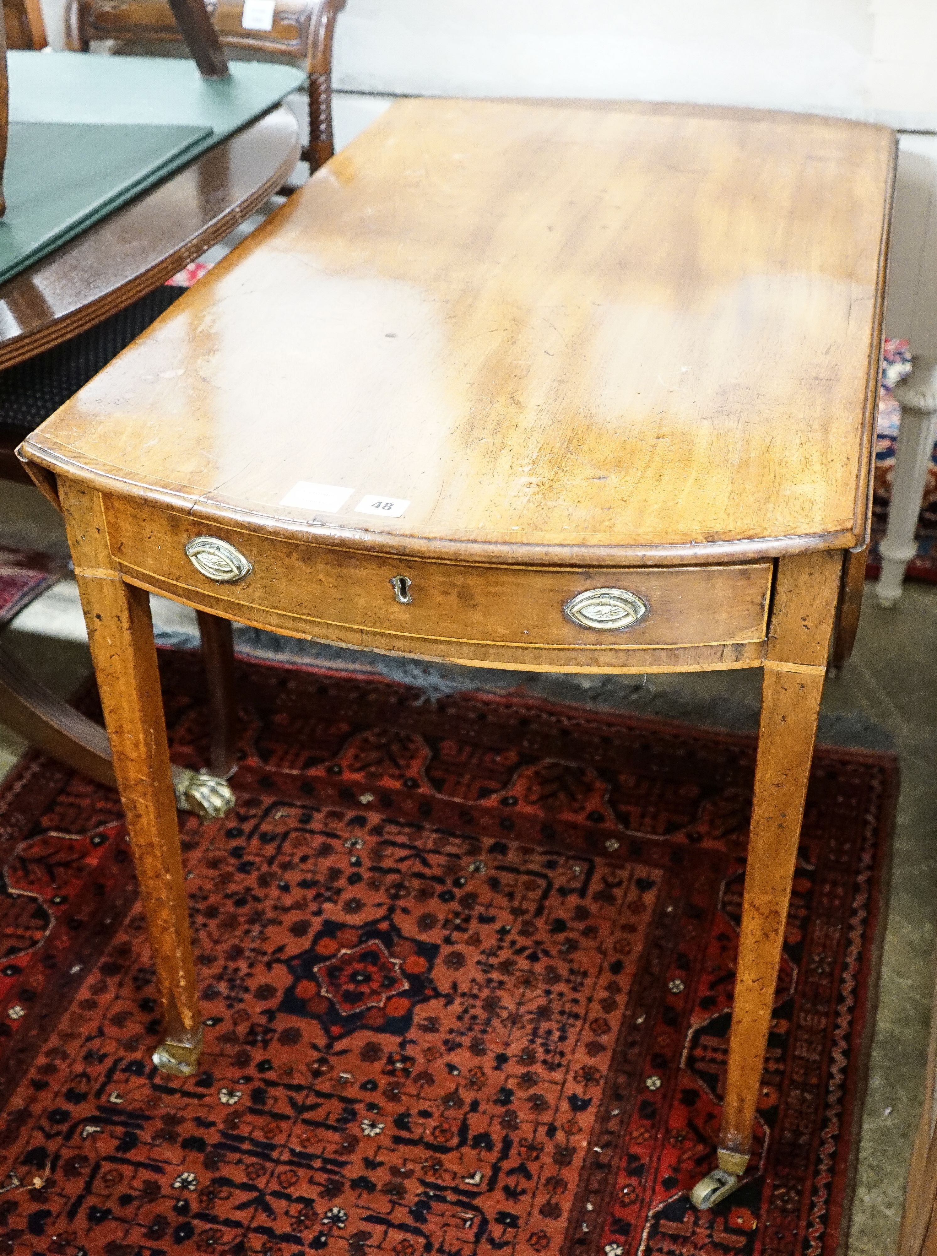 A George III banded mahogany oval topped Pembroke table, width 59cm, depth 102cm, height 71cm